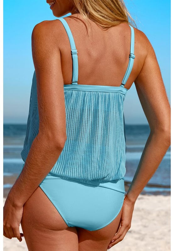 Our styles are designed with a trendy fitted look in mind following an international size standard. For the best fit we suggest choosing one size up from your usual. Be sure to check our sizing chart to find your perfect match!
  Flattering and stylish tankini
  Turquoise striped mesh design
  Trendy knotted hem detail on the top
  High
  rise design for easy pull
  on
  Adjustable straps for a customizable fit
  Removable padded cups for added support and coverage
  Versatile tankini suitable for pairing with coverups
Material: 82% Polyamide 18% Elastane