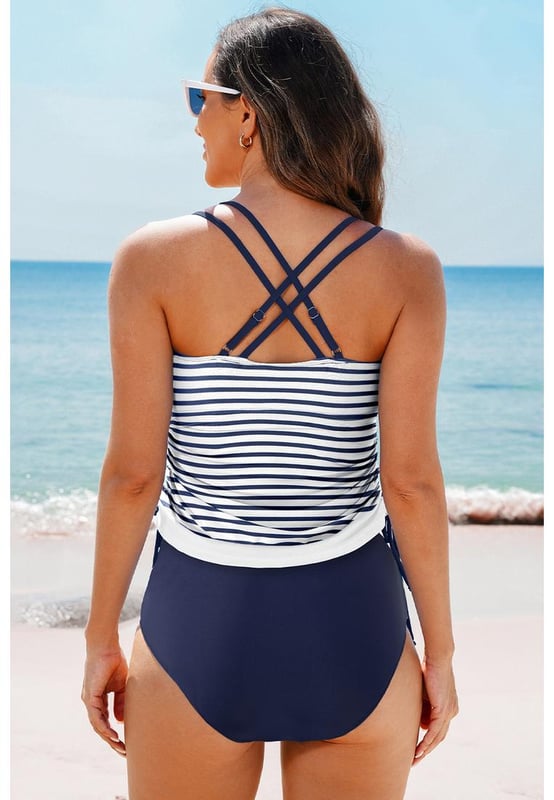 Our styles are designed with a trendy fitted look in mind following an international size standard. For the best fit we suggest choosing one size up from your usual. Be sure to check our sizing chart to find your perfect match!
  Color block design for the tankini top
  Strappy back
  Drawstring sides
  Includes floral print swim shorts
  Multiple color and size options available
Material: 82% Polyamide 18% Elastane