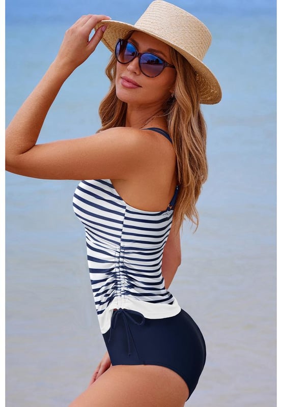 Our styles are designed with a trendy fitted look in mind following an international size standard. For the best fit we suggest choosing one size up from your usual. Be sure to check our sizing chart to find your perfect match!
  Color block design for the tankini top
  Strappy back
  Drawstring sides
  Includes floral print swim shorts
  Multiple color and size options available
Material: 82% Polyamide 18% Elastane