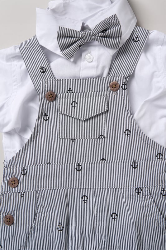 Dress your little one in style with this adorable bodysuit shirt and dungarees set by Little Gent. Complete with a charming bowtie, this outfit is perfect for any occasion. Designed with playful charm and practicality in mind, it’s an ideal choice to keep your little one looking dapper all day long.