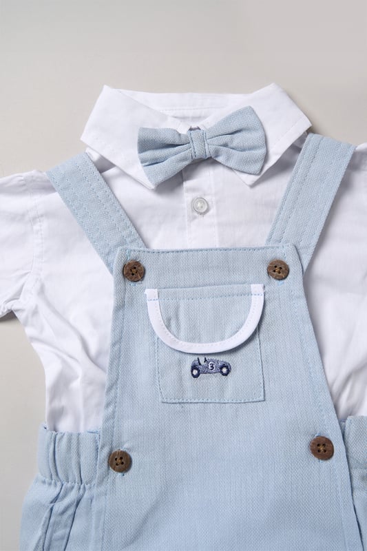 Dress your little one in style with this adorable bodysuit shirt and dungarees set by Little Gent. Complete with a charming bowtie, this outfit is perfect for any occasion. Designed with playful charm and practicality in mind, it’s an ideal choice to keep your little one looking dapper all day long.