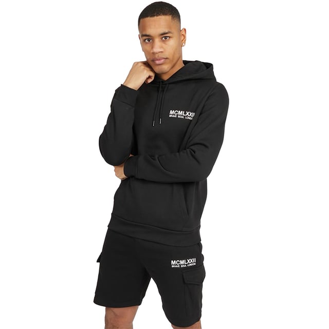 Introducing this matching hoody and jogger set from Brave Soul, the newest addition to your wardrobe. The overhead hoodie features ribbed elasticated cuffs and hem, hood with drawstring and kangaroo pocket, while the matching fleece shorts has an elasticated waist with cargo pockets and side welt pockets. Team with a pair of trainers to complete your casual look making it the ultimate everyday outfit. Model wears UK size M.