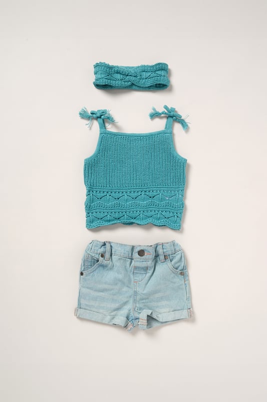 This adorable set by Miss includes a true knit top, denim shorts, and a matching headband. Perfect for warm days, it combines style and practicality, making it an ideal choice for playdates, outings, or casual summer looks.