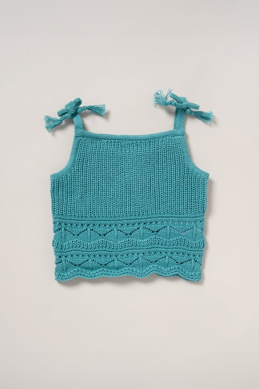This adorable set by Miss includes a true knit top, denim shorts, and a matching headband. Perfect for warm days, it combines style and practicality, making it an ideal choice for playdates, outings, or casual summer looks.