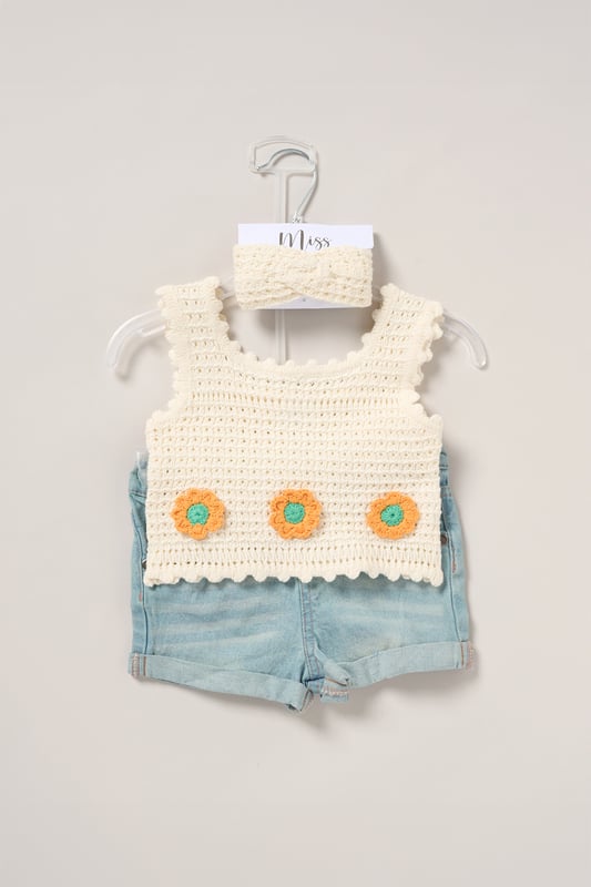 This adorable set by Miss includes a true knit top, denim shorts, and a matching headband. Perfect for warm days, it combines style and practicality, making it an ideal choice for playdates, outings, or casual summer looks.