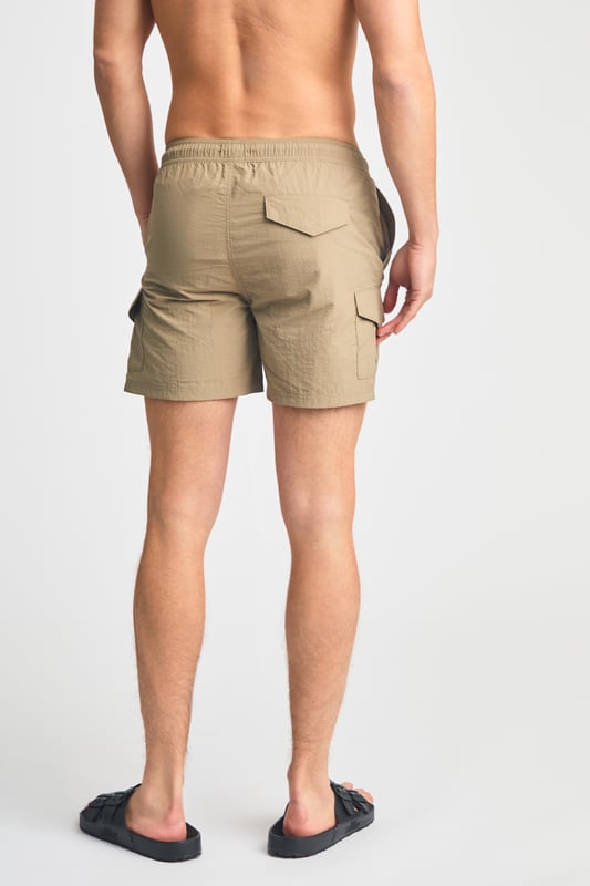 This two pack of combat, cargo-style swim shorts from French Connection are perfect for the beach or by the pool. Each swim short features an elasticated waistband with a drawcord, two side pockets and two cargo-style pockets. Made from quick-drying, polyester with mesh liner. This pack contains two swim shorts in black and khaki.