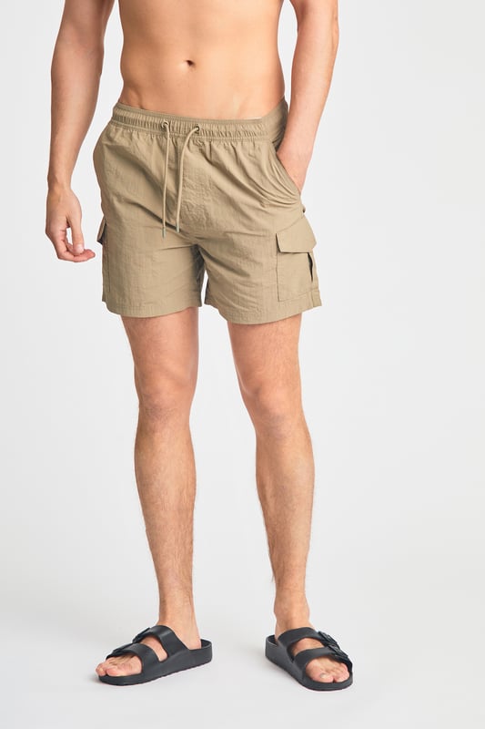 This two pack of combat, cargo-style swim shorts from French Connection are perfect for the beach or by the pool. Each swim short features an elasticated waistband with a drawcord, two side pockets and two cargo-style pockets. Made from quick-drying, polyester with mesh liner. This pack contains two swim shorts in black and khaki.