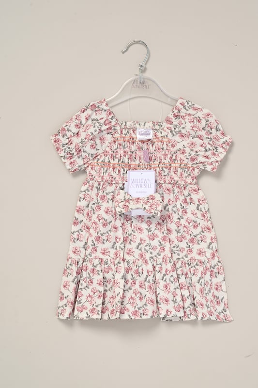 This printed summer dress and bow headband outfit set by Miss is the perfect addition to your little one’s summer wardrobe. The dress features tiered ruffles, cap sleeves, and a delicate floral print, creating a cute look perfect for sunny days, casual outings, or special occasions.