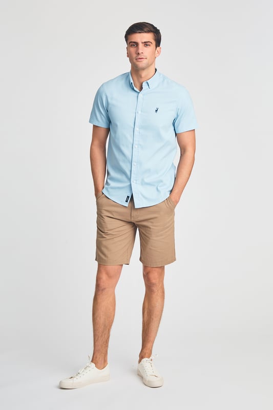 This cotton oxford style shirt from Kensington Eastside is a wardrobe staple. Features button-down collar, embroidered logo and short sleeve. Made from cotton fabric to ensure comfort and high quality. Other colours available.