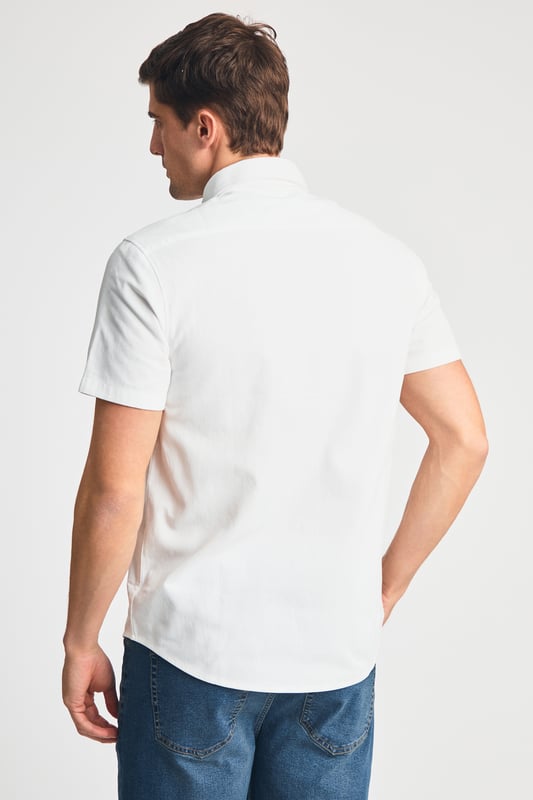 This cotton oxford style shirt from Kensington Eastside is a wardrobe staple. Features button-down collar, embroidered logo and short sleeve. Made from cotton fabric to ensure comfort and high quality. Other colours available.