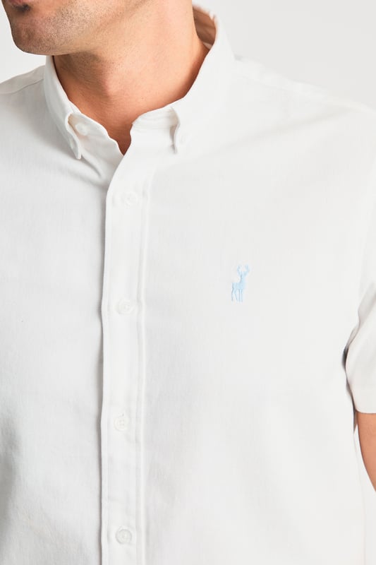 This cotton oxford style shirt from Kensington Eastside is a wardrobe staple. Features button-down collar, embroidered logo and short sleeve. Made from cotton fabric to ensure comfort and high quality. Other colours available.
