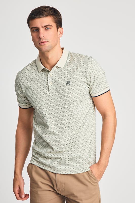 This textured cotton polo shirt from Kensington Eastside blends classic sophistication with modern design. Crafted from a premium fabric with a subtle pattern, it offers a refined yet contemporary look. Lightweight and breathable, it’s a versatile choice for smart-casual occasions, ensuring style and comfort effortlessly.