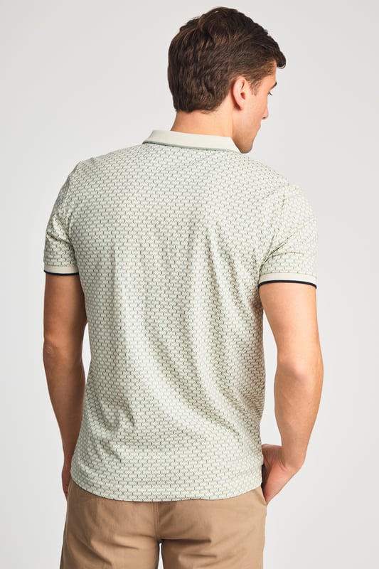 This textured cotton polo shirt from Kensington Eastside blends classic sophistication with modern design. Crafted from a premium fabric with a subtle pattern, it offers a refined yet contemporary look. Lightweight and breathable, it’s a versatile choice for smart-casual occasions, ensuring style and comfort effortlessly.