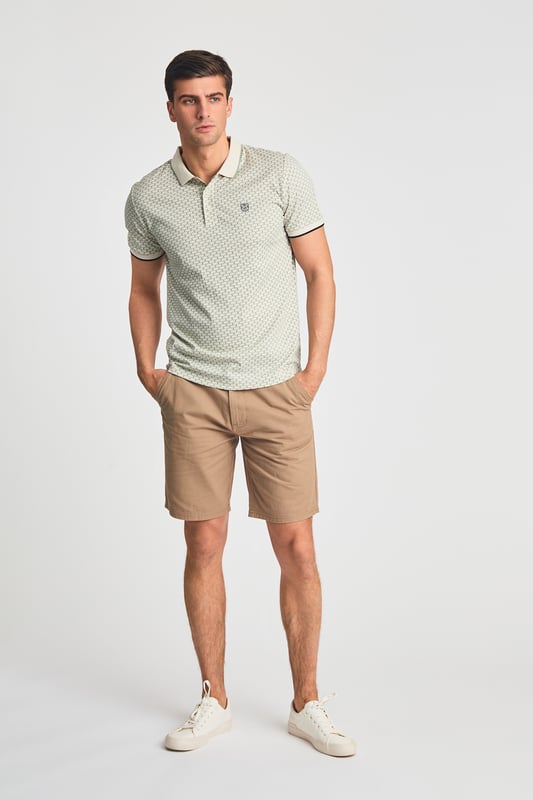 This textured cotton polo shirt from Kensington Eastside blends classic sophistication with modern design. Crafted from a premium fabric with a subtle pattern, it offers a refined yet contemporary look. Lightweight and breathable, it’s a versatile choice for smart-casual occasions, ensuring style and comfort effortlessly.