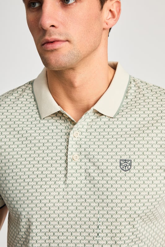 This textured cotton polo shirt from Kensington Eastside blends classic sophistication with modern design. Crafted from a premium fabric with a subtle pattern, it offers a refined yet contemporary look. Lightweight and breathable, it’s a versatile choice for smart-casual occasions, ensuring style and comfort effortlessly.