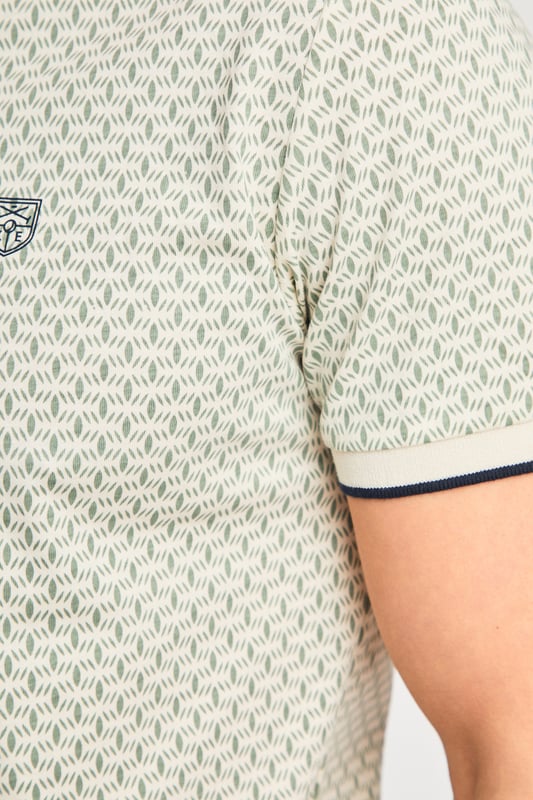 This textured cotton polo shirt from Kensington Eastside blends classic sophistication with modern design. Crafted from a premium fabric with a subtle pattern, it offers a refined yet contemporary look. Lightweight and breathable, it’s a versatile choice for smart-casual occasions, ensuring style and comfort effortlessly.