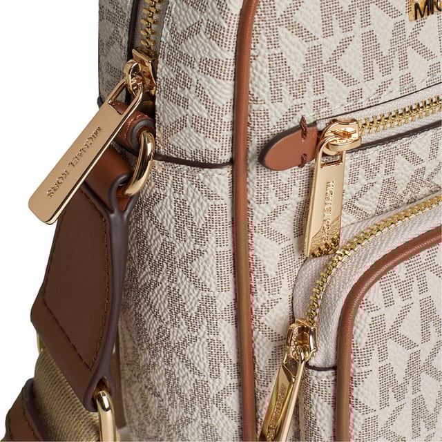 Ideal for travel and city walks, this crossbody bag features our signature logo print and features a convenient canvas strap and multiple pockets to keep your essentials organized and close at hand.\n\n Details:\n - Accessory type: Shoulder bag.\n - Canvas with logo print.\n - Application of the brand name in metal.\n - Hardware: Gold tone.\n - Exterior details: 2 front zipper pockets.\n - Interior details: Open back pocket.\n - Adjustable strap.\n - Closure: Zipper.\n\n Each of Michael Kors' accessories collections features a strong identity, offering a fresh mix of trends, colors, and silhouettes that never go out of style, with urban style and attitude. Each women's shoulder bag designed by Michael Kors is an affordable luxury with a touch of modern, unexpected, and comfortable glamour, offering a piece for every occasion.\n Measures: 14 cm (W) x 19.1 (H) x 5.1 cm (D)\n Composition: 89.4% Coated Canvas, 9.6% Polyester, 1% Polyurethane\n Care:\nClean with a dry or slightly damp cloth.