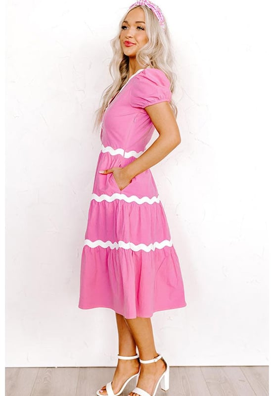 Our styles are designed with a trendy fitted look in mind following an international size standard. For the best fit we suggest choosing one size up from your usual. Be sure to check our sizing chart to find your perfect match!
  High waist dress for a defined silhouette
  Short puff sleeves for a charming feminine touch
  Flowy midi length for a graceful and versatile style
  Delicate ric rac trim detailing for a boho
  chic look
Material: 100% Cotton