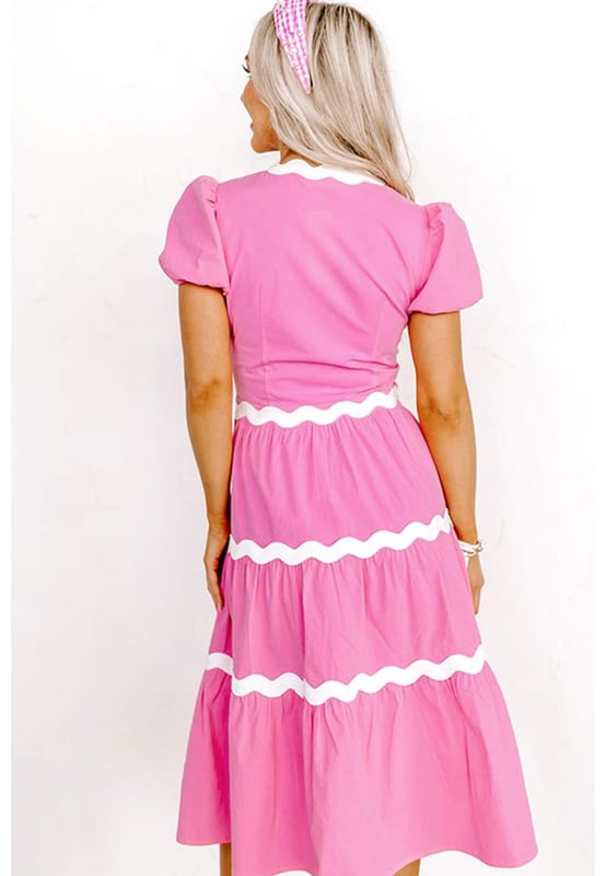 Our styles are designed with a trendy fitted look in mind following an international size standard. For the best fit we suggest choosing one size up from your usual. Be sure to check our sizing chart to find your perfect match!
  High waist dress for a defined silhouette
  Short puff sleeves for a charming feminine touch
  Flowy midi length for a graceful and versatile style
  Delicate ric rac trim detailing for a boho
  chic look
Material: 100% Cotton