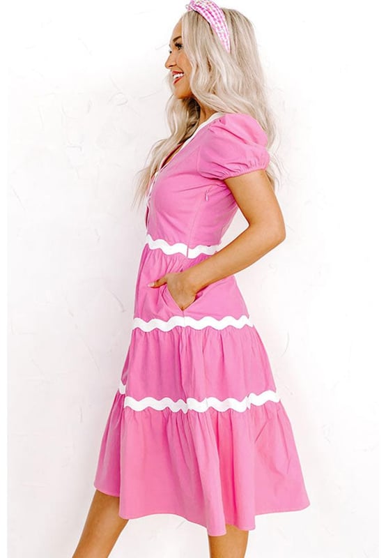 Our styles are designed with a trendy fitted look in mind following an international size standard. For the best fit we suggest choosing one size up from your usual. Be sure to check our sizing chart to find your perfect match!
  High waist dress for a defined silhouette
  Short puff sleeves for a charming feminine touch
  Flowy midi length for a graceful and versatile style
  Delicate ric rac trim detailing for a boho
  chic look
Material: 100% Cotton