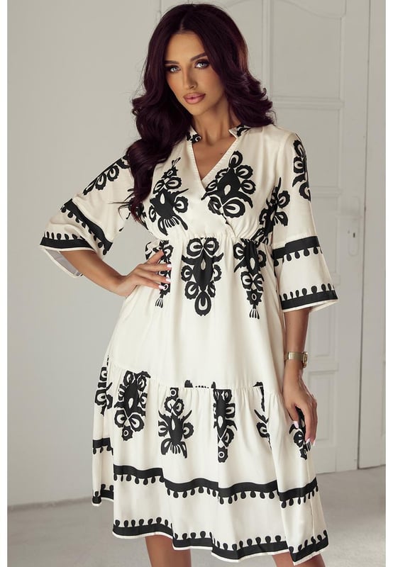 Our styles are designed with a trendy fitted look in mind following an international size standard. For the best fit we suggest choosing one size up from your usual. Be sure to check our sizing chart to find your perfect match!
  Beige Western Geometric Print Midi Dress
  Eye
  catching geometric print
  Flattering V
  neck wrap design
  3/4 sleeves for a stylish and versatile silhouette
  High waist detail enhances the figure
Material: 100% Polyester
