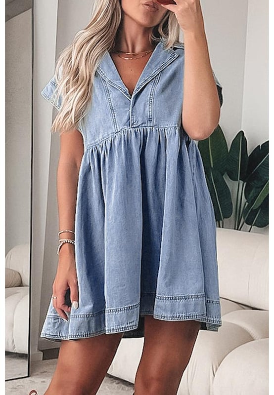 Our styles are designed with a trendy fitted look in mind following an international size standard. For the best fit we suggest choosing one size up from your usual. Be sure to check our sizing chart to find your perfect match!
  High waist design for an elongated look
  Babydoll silhouette for a vintage
  inspired style
  Cap sleeves for subtle shoulder coverage
  Lapel neck detail adds sophistication and polish
  Denim fabric for a chic and casual balance
Material: 82% Cotton 10% Polyester 8% Viscose