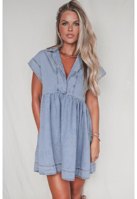Our styles are designed with a trendy fitted look in mind following an international size standard. For the best fit we suggest choosing one size up from your usual. Be sure to check our sizing chart to find your perfect match!
  High waist design for an elongated look
  Babydoll silhouette for a vintage
  inspired style
  Cap sleeves for subtle shoulder coverage
  Lapel neck detail adds sophistication and polish
  Denim fabric for a chic and casual balance
Material: 82% Cotton 10% Polyester 8% Viscose