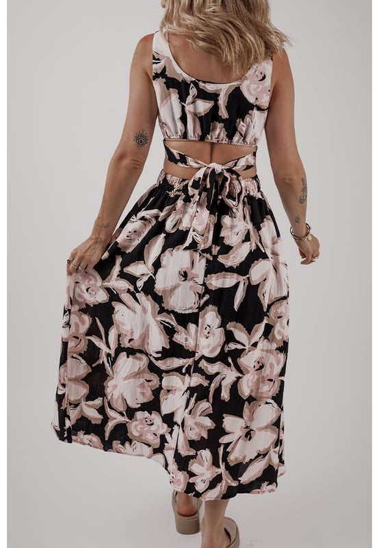 Black floral cutout maxi dress
  Square neck
  Sleeveless design
  Maxi length
  Knot back detail
  Flowy silhouette
Material: 100% Viscose