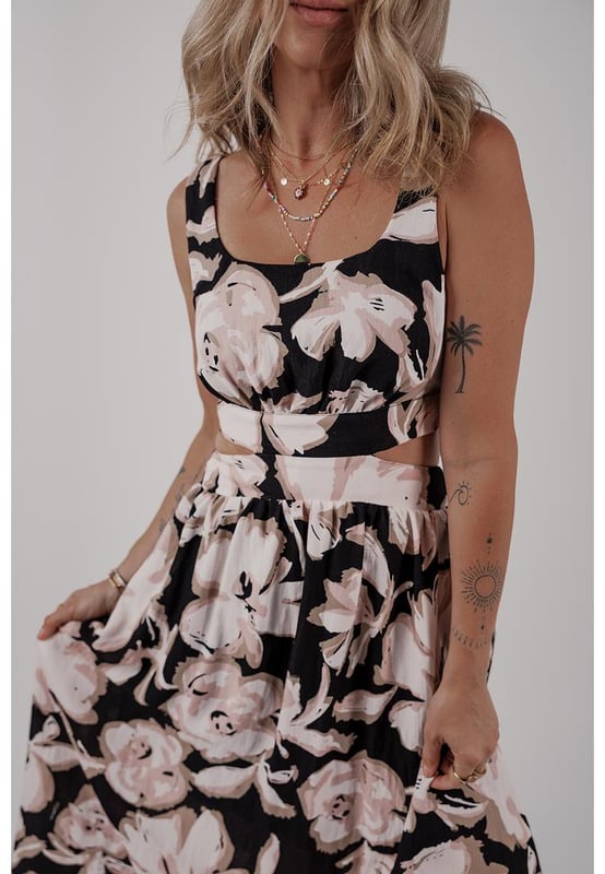 Black floral cutout maxi dress
  Square neck
  Sleeveless design
  Maxi length
  Knot back detail
  Flowy silhouette
Material: 100% Viscose