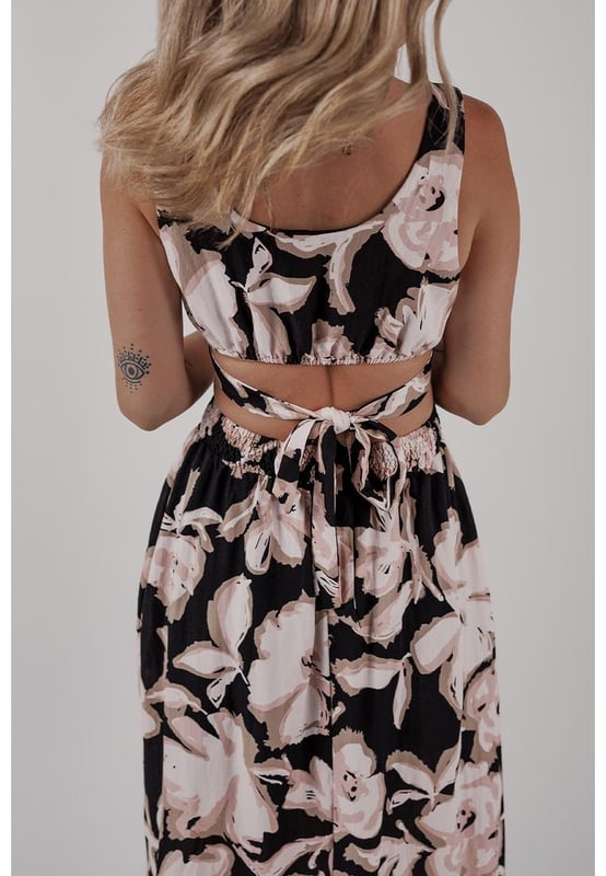 Black floral cutout maxi dress
  Square neck
  Sleeveless design
  Maxi length
  Knot back detail
  Flowy silhouette
Material: 100% Viscose