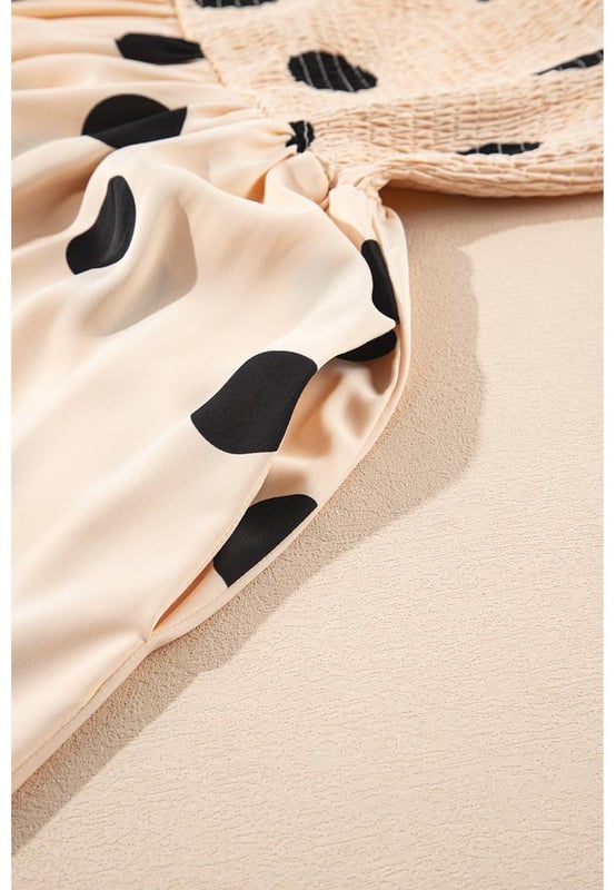 Elegant polka dot pattern
  Flattering silhouette with smocked bodice
  High waist design
  Flowy skirt for added grace
  Sleeveless for a flirty touch
  Ideal for pairing with layering necklaces and high heels
Material: 100% Polyester