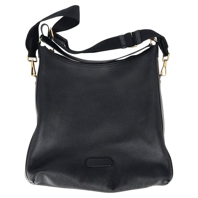 VINTAGE, RRP AS NEW
The Tom Ford Hand-held Tote Bag in black leather is a statement of refined craftsmanship and versatility. Featuring a sleek logo patch on the front, a branded zip puller, and gold-tone logo-engraved hardware, this tote exudes luxury. The top zip fastening ensures your essentials are secure, while the adjustable, detachable shoulder strap offers convenience for hands-free carrying. The detachable top handle adds a touch of sophistication, and the internal zip-fastening pocket provides organizational ease. With its spacious main compartment and subtle internal logo stamp, this bag combines form, function, and luxury in perfect harmony.


with dust bag

Tom Ford Hand-held Tote Bag in Black Leather
Condition: Excellent
Signs of wear: No retail tag, No visible sign of wear., 
Packaging: Dust bag
Color: black
Material: Leather | leather
Size: One Size | One Size
Measurements: Width: 80; Height: 440; Length: 450; Handle drop: 200; Strap length: 800
SKU: MRPPUGBBA464106M