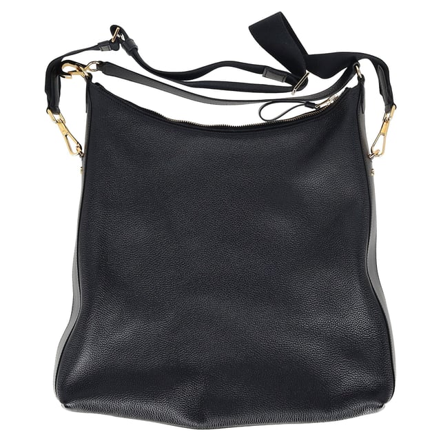 VINTAGE, RRP AS NEW
The Tom Ford Hand-held Tote Bag in black leather is a statement of refined craftsmanship and versatility. Featuring a sleek logo patch on the front, a branded zip puller, and gold-tone logo-engraved hardware, this tote exudes luxury. The top zip fastening ensures your essentials are secure, while the adjustable, detachable shoulder strap offers convenience for hands-free carrying. The detachable top handle adds a touch of sophistication, and the internal zip-fastening pocket provides organizational ease. With its spacious main compartment and subtle internal logo stamp, this bag combines form, function, and luxury in perfect harmony.


with dust bag

Tom Ford Hand-held Tote Bag in Black Leather
Condition: Excellent
Signs of wear: No retail tag, No visible sign of wear., 
Packaging: Dust bag
Color: black
Material: Leather | leather
Size: One Size | One Size
Measurements: Width: 80; Height: 440; Length: 450; Handle drop: 200; Strap length: 800
SKU: MRPPUGBBA464106M