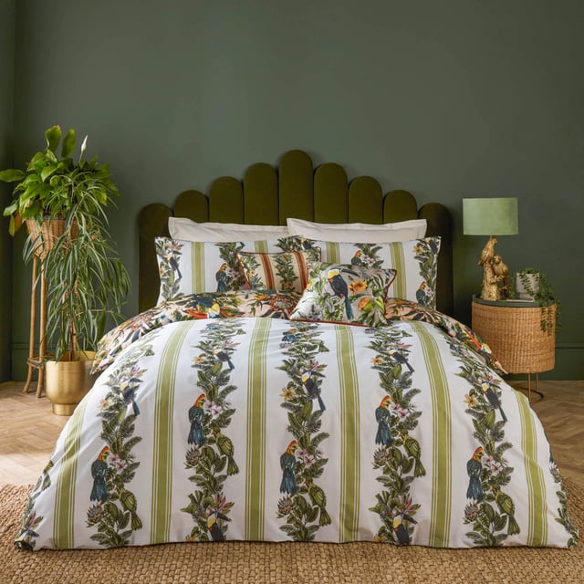 furn. Leilani Printed Floral Duvet Sets Transform your bedroom into an exotic sanctuary with the Leilani Duvet Cover Set. Crafted from a cotton blend fabric with a 180 thread count, this set offers both comfort and style. Each piece showcases a vibrant tapestry of tropical flora, fauna, and fruit, immersing you in a lush rainforest ambiance. Marvel at the songbirds amidst blooming foliage, where warm tones of blush and coral interplay with energetic teals and vivid oranges. Perfect for those who appreciate bold yet elegant decor, this set promises to express your unique personality and impress your guests.
