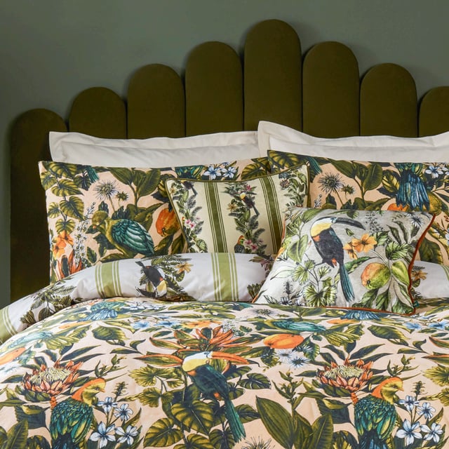 furn. Leilani Printed Floral Duvet Sets Transform your bedroom into an exotic sanctuary with the Leilani Duvet Cover Set. Crafted from a cotton blend fabric with a 180 thread count, this set offers both comfort and style. Each piece showcases a vibrant tapestry of tropical flora, fauna, and fruit, immersing you in a lush rainforest ambiance. Marvel at the songbirds amidst blooming foliage, where warm tones of blush and coral interplay with energetic teals and vivid oranges. Perfect for those who appreciate bold yet elegant decor, this set promises to express your unique personality and impress your guests.