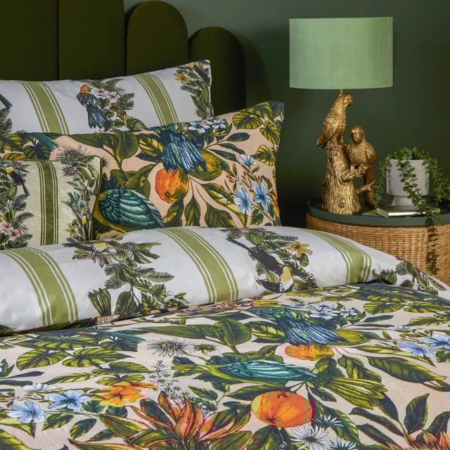 furn. Leilani Printed Floral Duvet Sets Transform your bedroom into an exotic sanctuary with the Leilani Duvet Cover Set. Crafted from a cotton blend fabric with a 180 thread count, this set offers both comfort and style. Each piece showcases a vibrant tapestry of tropical flora, fauna, and fruit, immersing you in a lush rainforest ambiance. Marvel at the songbirds amidst blooming foliage, where warm tones of blush and coral interplay with energetic teals and vivid oranges. Perfect for those who appreciate bold yet elegant decor, this set promises to express your unique personality and impress your guests.