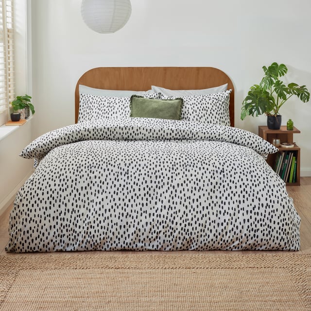 Transform your bedroom into a sanctuary of style and comfort with the Dottie Printed Duvet Cover Set. Crafted from a fabric blend with a 144 thread count, this set offers the perfect balance of softness and durability, ensuring restful nights every time. The playfully dotted design introduces a modern charm to your space, blending style with a hint of personality. Its lightweight, easy-care fabric simplifies your routine, allowing more time to enjoy your refreshed surroundings. Perfect for those who value both practicality and sophistication, this duvet cover set makes any bedroom feel effortlessly chic and uniquely yours.
