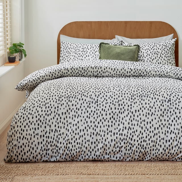 Transform your bedroom into a sanctuary of style and comfort with the Dottie Printed Duvet Cover Set. Crafted from a fabric blend with a 144 thread count, this set offers the perfect balance of softness and durability, ensuring restful nights every time. The playfully dotted design introduces a modern charm to your space, blending style with a hint of personality. Its lightweight, easy-care fabric simplifies your routine, allowing more time to enjoy your refreshed surroundings. Perfect for those who value both practicality and sophistication, this duvet cover set makes any bedroom feel effortlessly chic and uniquely yours.