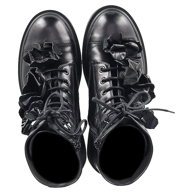 VINTAGE, RRP AS NEW
Romantic rebellion takes form in the Jimmy Choo Nari Flowers Combat Booties—a bold twist on the classic combat boot. Crafted in soft black lambskin leather, these Italian-made booties balance edge and elegance with intricate 3-D floral appliqués that bloom across the upper. A round cap toe, lace-up vamp, and side zip closure combine practicality with style, while a durable leather and rubber outsole ensures everyday wearability. Whether you're toughening up a feminine look or grounding a street-style outfit, these booties are the perfect floral statement.

with Box

Jimmy Choo Nari Flowers Combat Booties in Black Leather
Condition: Excellent
Signs of wear: Include Box., No visible sign of wear. No Mark at insole.,  Very light mark at soles.
Packaging: Box
Color: black
Material: Leather | leather
Size: EU | 37.5
Measurements: Heel height: 50; Insole length: 300
SKU: NAPPUGBSH466103W