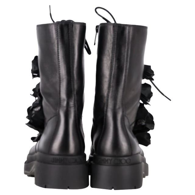 VINTAGE, RRP AS NEW
Romantic rebellion takes form in the Jimmy Choo Nari Flowers Combat Booties—a bold twist on the classic combat boot. Crafted in soft black lambskin leather, these Italian-made booties balance edge and elegance with intricate 3-D floral appliqués that bloom across the upper. A round cap toe, lace-up vamp, and side zip closure combine practicality with style, while a durable leather and rubber outsole ensures everyday wearability. Whether you're toughening up a feminine look or grounding a street-style outfit, these booties are the perfect floral statement.

with Box

Jimmy Choo Nari Flowers Combat Booties in Black Leather
Condition: Excellent
Signs of wear: Include Box., No visible sign of wear. No Mark at insole.,  Very light mark at soles.
Packaging: Box
Color: black
Material: Leather | leather
Size: EU | 37.5
Measurements: Heel height: 50; Insole length: 300
SKU: NAPPUGBSH466103W