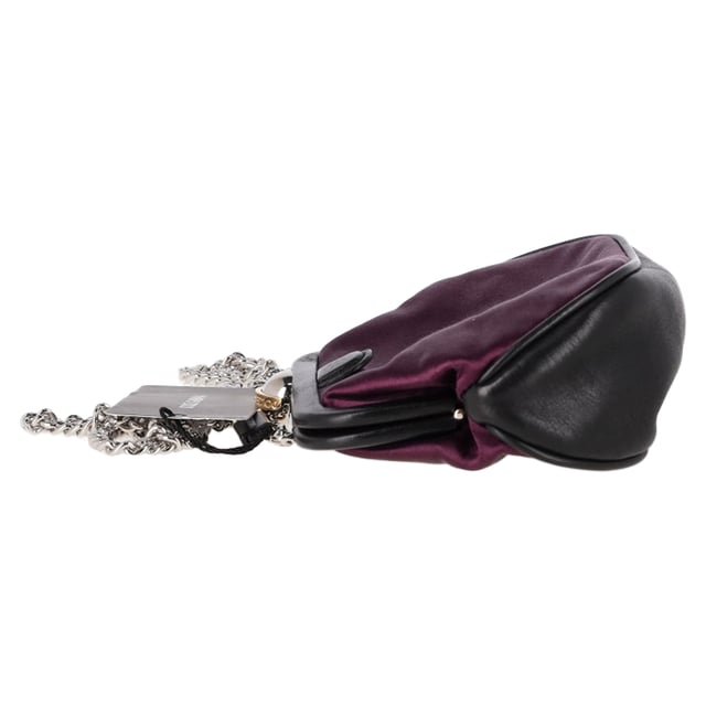 The Dolce & Gabbana Clasp Chain Clutch Bag in dark purple silk combines timeless elegance with bold luxury, featuring a lustrous silk fabric and ornate clasp closure. The rich purple hue adds a regal touch, making it the perfect accessory for evening events or formal occasions. Pair it with a little black dress or a sleek satin gown for a sophisticated, high-fashion look, or contrast it with a more casual outfit to elevate your style. The delicate chain strap allows for versatile wear, whether carried as a clutch or draped elegantly over the shoulder.

 Dolce & Gabbana Clasp Chain Clutch Bag in Dark Purple Silk

Condition: New with tag
Signs of wear: Out of store condition, no visible signs of wear.
Packaging: Dust bag
Color: Purple
Material: Silk
Size: One Size | One Size
Measurements: Width: 50; Height: 120; Length: 200
SKU: NAPPUGBBA464732W