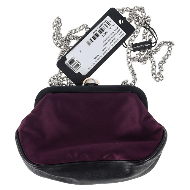 The Dolce & Gabbana Clasp Chain Clutch Bag in dark purple silk combines timeless elegance with bold luxury, featuring a lustrous silk fabric and ornate clasp closure. The rich purple hue adds a regal touch, making it the perfect accessory for evening events or formal occasions. Pair it with a little black dress or a sleek satin gown for a sophisticated, high-fashion look, or contrast it with a more casual outfit to elevate your style. The delicate chain strap allows for versatile wear, whether carried as a clutch or draped elegantly over the shoulder.

 Dolce & Gabbana Clasp Chain Clutch Bag in Dark Purple Silk

Condition: New with tag
Signs of wear: Out of store condition, no visible signs of wear.
Packaging: Dust bag
Color: Purple
Material: Silk
Size: One Size | One Size
Measurements: Width: 50; Height: 120; Length: 200
SKU: NAPPUGBBA464732W