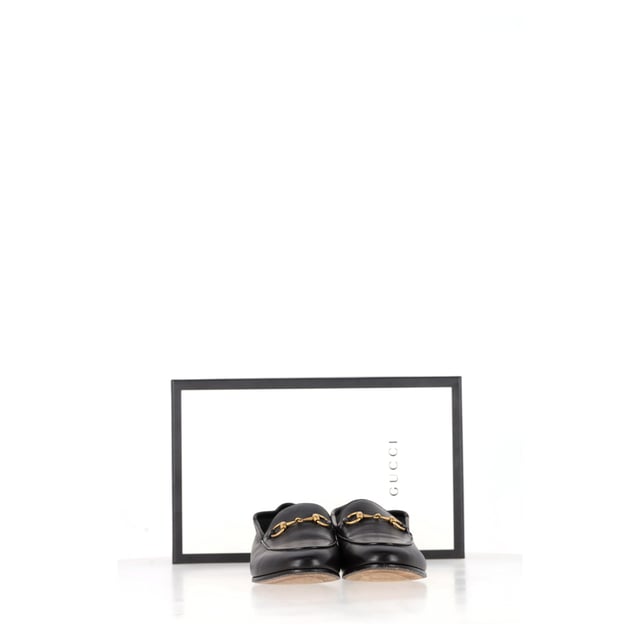 VINTAGE, RRP AS NEW
Gucci’s Brixton Convertible Loafers in Black Leather are the epitome of understated luxury and versatility. Made from incredibly soft black leather, these loafers feature the brand’s signature horsebit detail, adding a touch of elegance. The innovative design lets you wear the heel up for a polished loafer look or fold it down to create a comfortable, chic slipper. The leather lining and sole provide a smooth, luxurious fit, making these shoes perfect for all-day wear.

with Box, Dust bag

Gucci Brixton Convertible Loafers in Black Leather
Condition: very good
Signs of wear: Include Box., No visible sign of wear. No Mark at insole.,  Very light mark at soles.
Packaging: Box, Dust bag
Color: black
Material: Leather | leather
Size: EU | 37
Measurements: Insole length: 270
SKU: NAPPUGBSH466107W