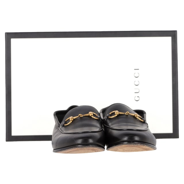 VINTAGE, RRP AS NEW
Gucci’s Brixton Convertible Loafers in Black Leather are the epitome of understated luxury and versatility. Made from incredibly soft black leather, these loafers feature the brand’s signature horsebit detail, adding a touch of elegance. The innovative design lets you wear the heel up for a polished loafer look or fold it down to create a comfortable, chic slipper. The leather lining and sole provide a smooth, luxurious fit, making these shoes perfect for all-day wear.

with Box, Dust bag

Gucci Brixton Convertible Loafers in Black Leather
Condition: very good
Signs of wear: Include Box., No visible sign of wear. No Mark at insole.,  Very light mark at soles.
Packaging: Box, Dust bag
Color: black
Material: Leather | leather
Size: EU | 37
Measurements: Insole length: 270
SKU: NAPPUGBSH466107W