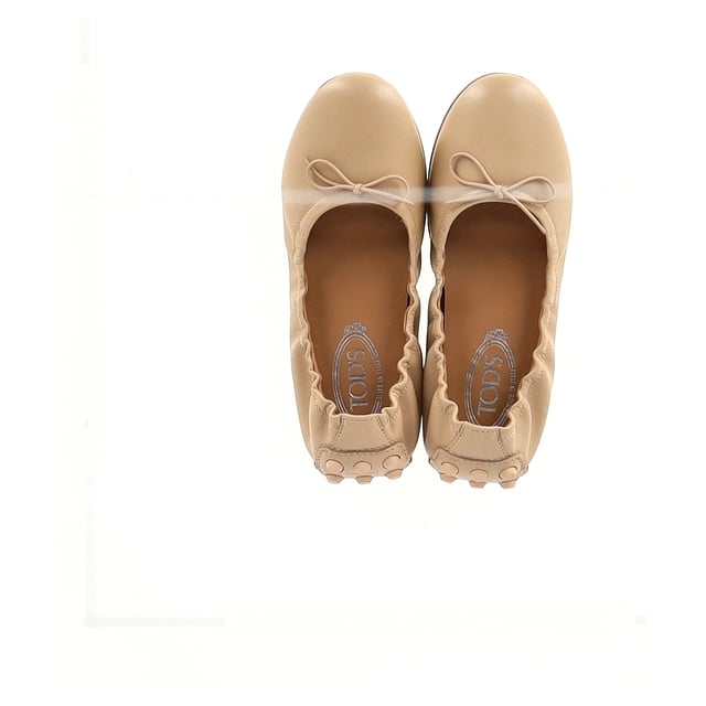 VINTAGE, RRP AS NEW
Step into timeless elegance with the **Tod's Gommino Ballet Flats in Nude Calf Leather**. Handcrafted from supple leather, these flats feature the iconic pebbled rubber sole for comfort and grip with every step. The nude shade offers effortless versatility, perfect for both polished work looks and relaxed weekend outfits. **Styling tip:** Pair them with cropped trousers or a midi skirt to showcase their refined silhouette and keep your look chic and understated.

 Tod's Gommino Ballet Flats in Nude Calf Leather

Condition: Excellent
Signs of wear: No visible sign of wear. No Mark at insole.,  Very light mark at soles.
Packaging: Dust bag
Color: Brown | nude
Material: Leather | calfskin leather
Size: EU | 38
Measurements: Insole length: 270
SKU: NAPPUGBSH466605W