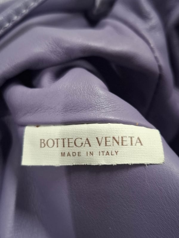 VINTAGE, RRP AS NEW
Add a splash of color to your accessory collection with the Bottega Veneta Mini Pouch in Pastel Purple Lambskin Leather. This beautifully crafted pouch features a soft leather body that feels luxurious to the touch, paired with a flat leather strap for easy wear. The magnetic closure ensures secure storage while maintaining a sleek, minimalist design. This mini pouch is the perfect accessory to complement a white flowy dress or a tailored pantsuit, adding a pop of pastel to your outfit. It can also be styled with a casual weekend look, such as a denim jacket and high-waisted jeans, for an effortlessly chic appearance. Ideal for both day-to-night wear, this versatile bag will bring a modern twist to your ensemble.
with Dust bag
Bottega Veneta Mini Pouch in Pastel Purple Lambskin Leather
Condition: Excellent
Signs of wear: No retail tag, No visible sign of wear., 
Packaging: Dust bag
Color: pastel purple
Material: Leather | leather
Size: One Size | One Size
Measurements: Width: 60; Height: 120; Length: 220; Handle drop: 630; Strap length: 1260
SKU: 468518 / NAPPUGBBA462920W