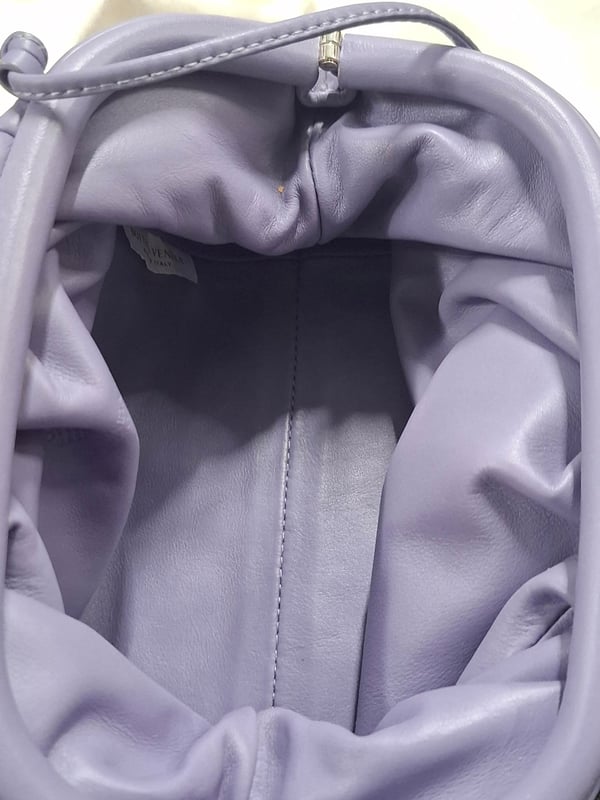 VINTAGE, RRP AS NEW
Add a splash of color to your accessory collection with the Bottega Veneta Mini Pouch in Pastel Purple Lambskin Leather. This beautifully crafted pouch features a soft leather body that feels luxurious to the touch, paired with a flat leather strap for easy wear. The magnetic closure ensures secure storage while maintaining a sleek, minimalist design. This mini pouch is the perfect accessory to complement a white flowy dress or a tailored pantsuit, adding a pop of pastel to your outfit. It can also be styled with a casual weekend look, such as a denim jacket and high-waisted jeans, for an effortlessly chic appearance. Ideal for both day-to-night wear, this versatile bag will bring a modern twist to your ensemble.
with Dust bag
Bottega Veneta Mini Pouch in Pastel Purple Lambskin Leather
Condition: Excellent
Signs of wear: No retail tag, No visible sign of wear., 
Packaging: Dust bag
Color: pastel purple
Material: Leather | leather
Size: One Size | One Size
Measurements: Width: 60; Height: 120; Length: 220; Handle drop: 630; Strap length: 1260
SKU: 468518 / NAPPUGBBA462920W
