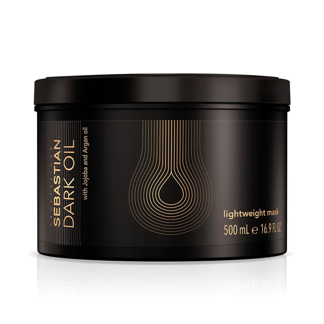 Experience the transformative power of Sebastian Professional Dark Oil Lightweight Hair Mask. This exceptional treatment is enriched with nourishing oils that hydrate and revitalize hair while maintaining its natural body. Say goodbye to dull, lifeless hair and hello to stunning shine. Perfect for all hair types, this mask is easy to use: shampoo your hair, towel dry, apply the mask, and leave it on for 2 to 5 minutes before rinsing. For enhanced results, mix in 2 drops of Dark Oil for greater styling versatility.