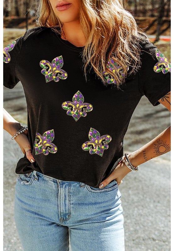Our styles are designed with a trendy fitted look in mind following an international size standard. For the best fit we suggest choosing one size up from your usual. Be sure to check our sizing chart to find your perfect match!
  Sequin Fleur de Lis graphic adds a sparkling touch
  Features vibrant Mardi Gras symbols
  Made from soft comfortable fabric
  Perfect for pairing with casual bottoms
  Ideal for parades or celebrations
Material: 62% Polyester 32% Cotton 6% Elastane