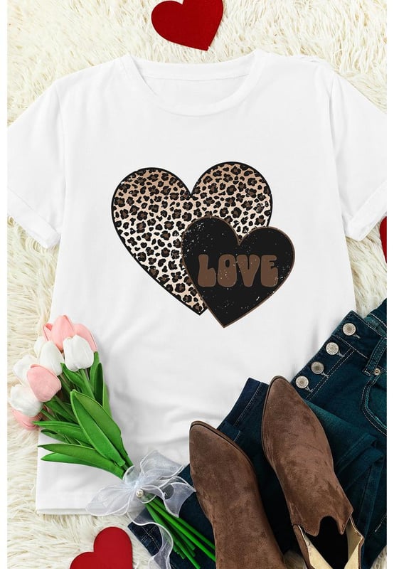 Our styles are designed with a trendy fitted look in mind following an international size standard. For the best fit we suggest choosing one size up from your usual. Be sure to check our sizing chart to find your perfect match!
  White Leopard LOVE Double Heart Printed Valentines Graphic Tee
  Large leopard heart and small letter
  printed heart design
  Cotton
  blend fabric for a soft and lightweight feel
  Simple yet chic design suitable for all ages
  Perfect for adding a playful touch to your Valentines Day outfit
Material: 62% Polyester 32% Cotton 6% Elastane